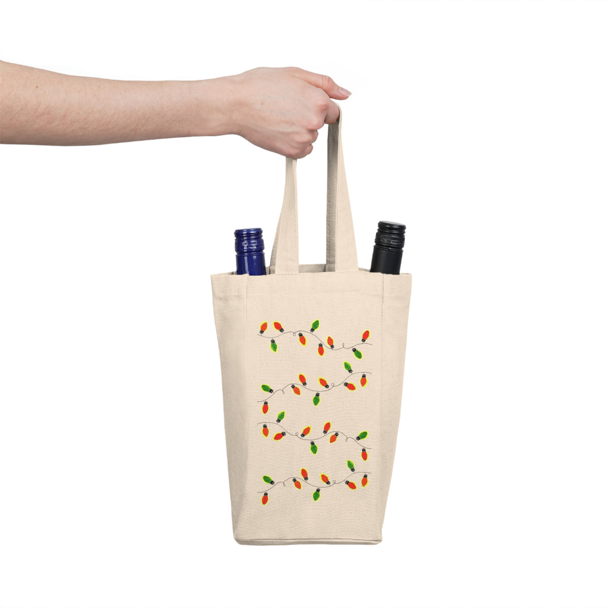 beige tote bag with christmas lights design holding two bottles, against a white background
